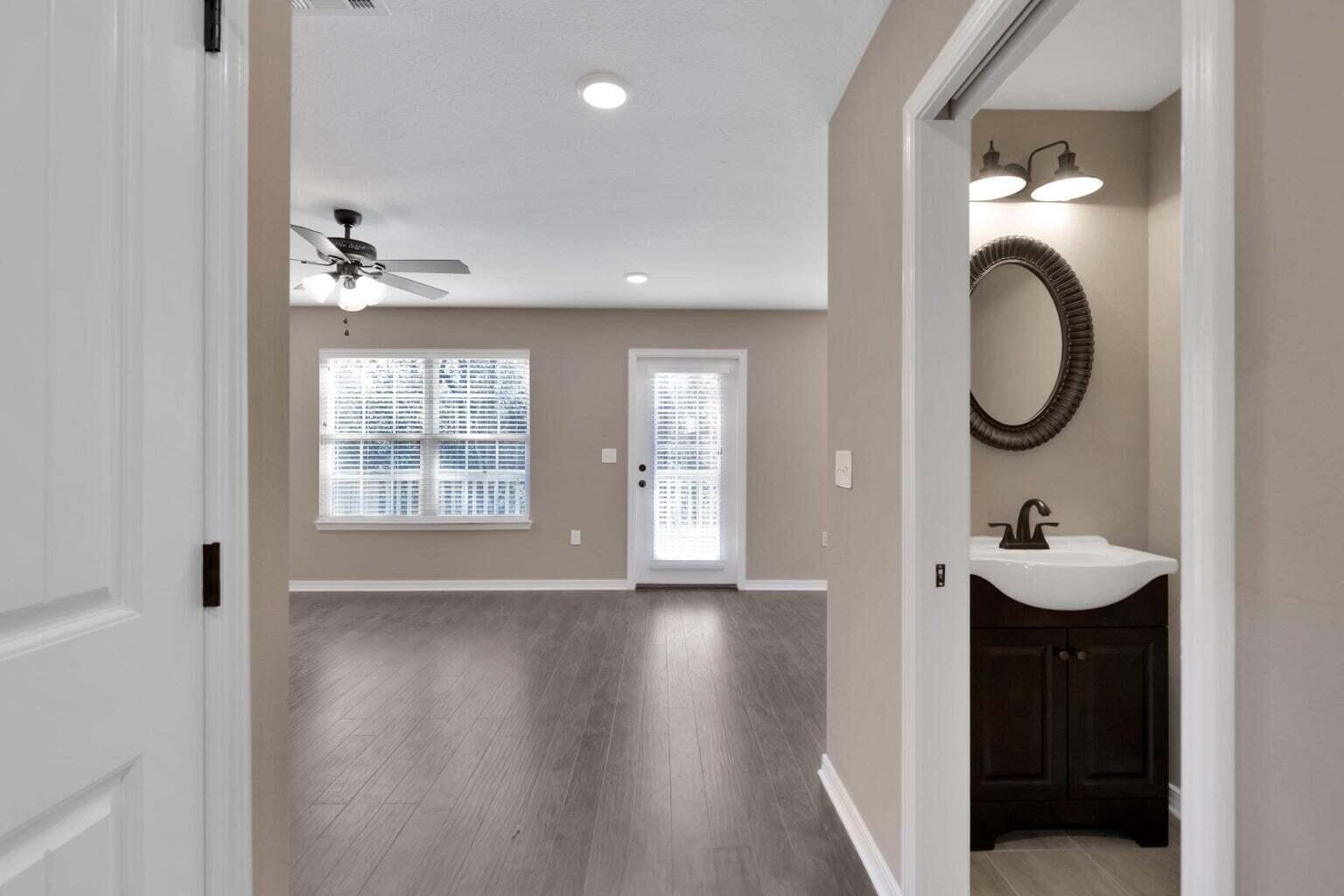 446 Eisenhower Drive Crestview, FL 32539 - Photo 12 of 25 a view of entryway with wooden floor