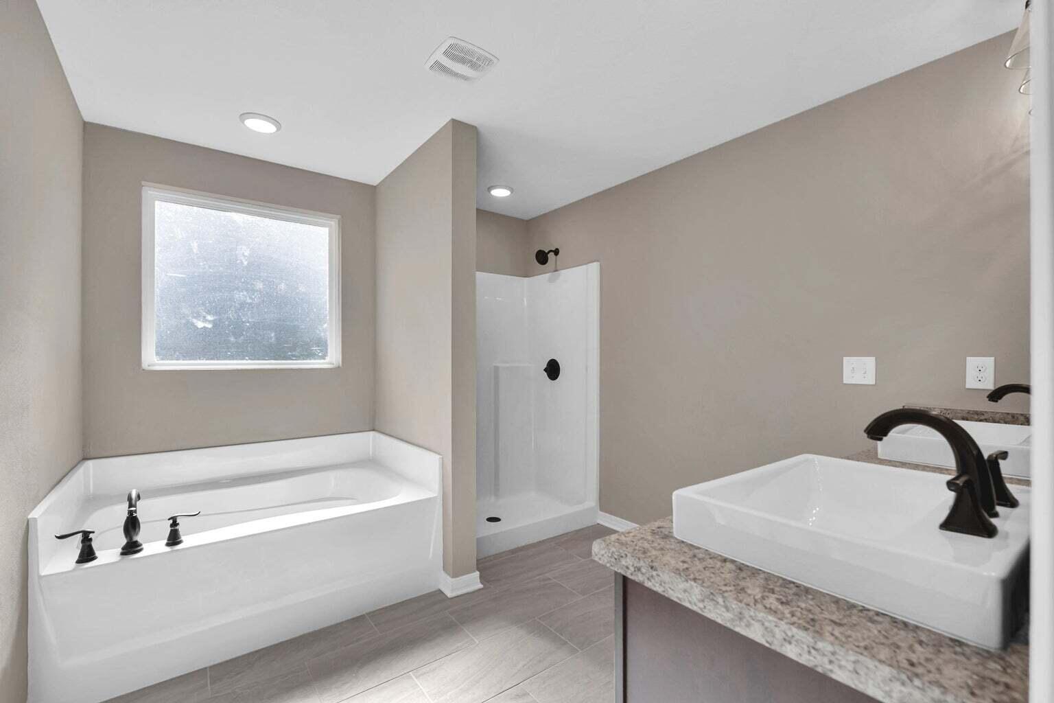 446 Eisenhower Drive Crestview, FL 32539 - Photo 17 of 25 a bathroom with a bathtub and a sink