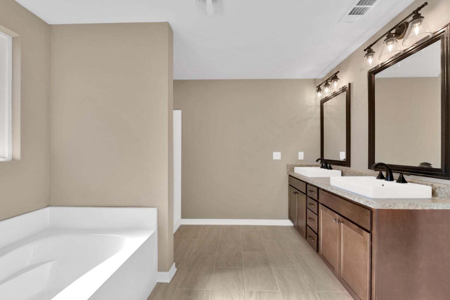 446 Eisenhower Drive Crestview, FL 32539 - Photo 18 of 25 a bathroom with a tub sink and mirror