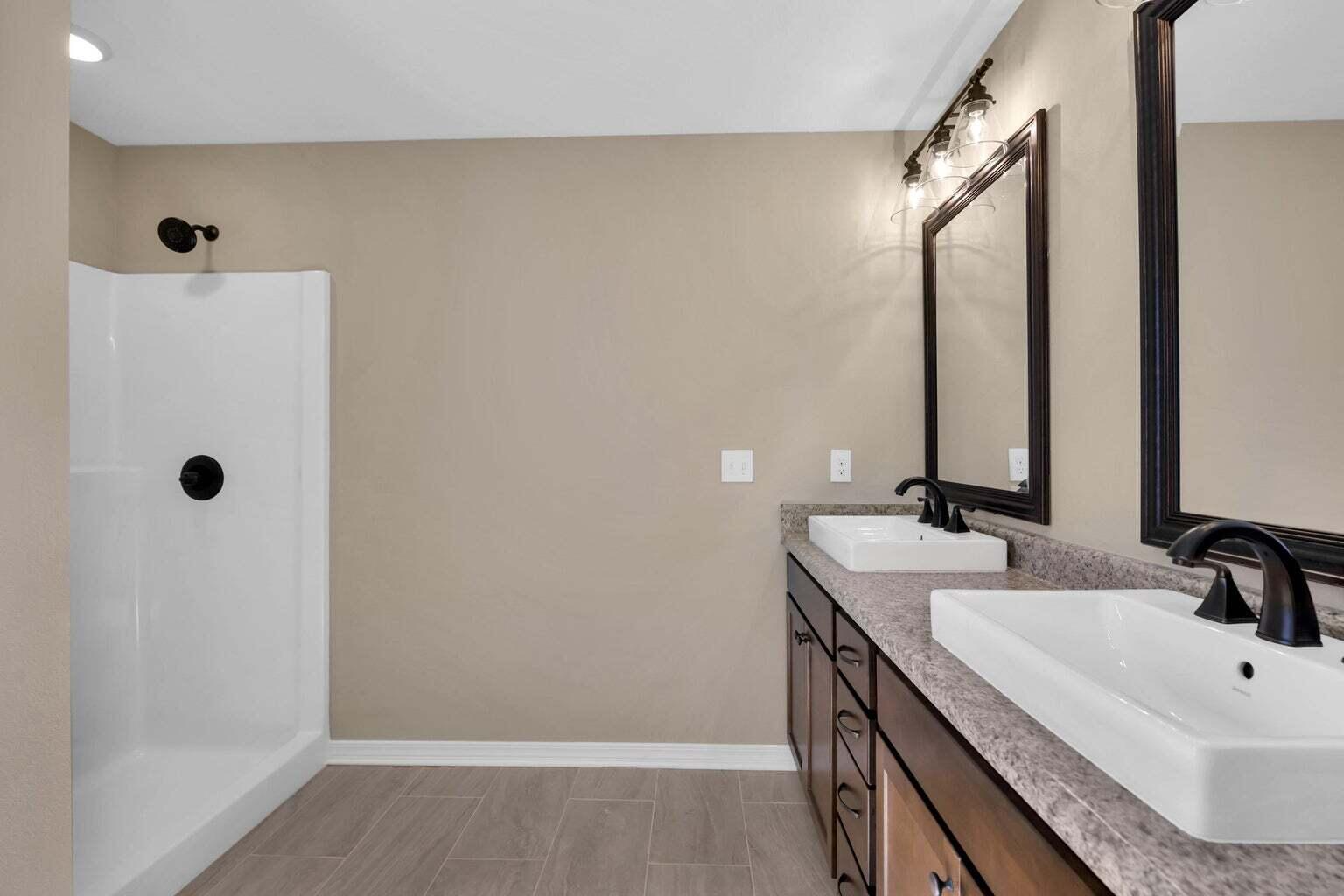 446 Eisenhower Drive Crestview, FL 32539 - Photo 19 of 25 a bathroom with double vanity sink and mirror