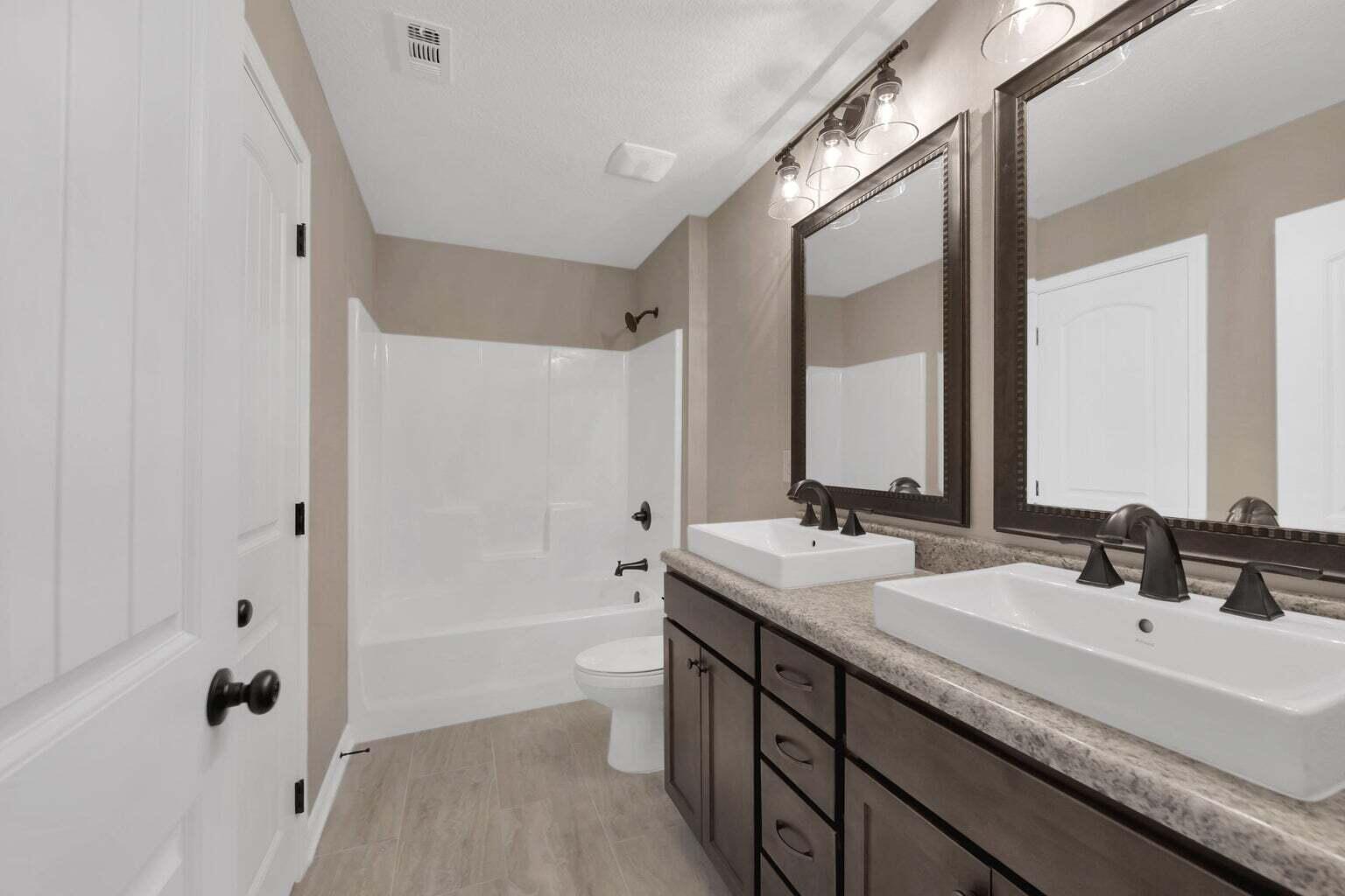 446 Eisenhower Drive Crestview, FL 32539 - Photo 20 of 25 a bathroom with a tub a sink and mirror