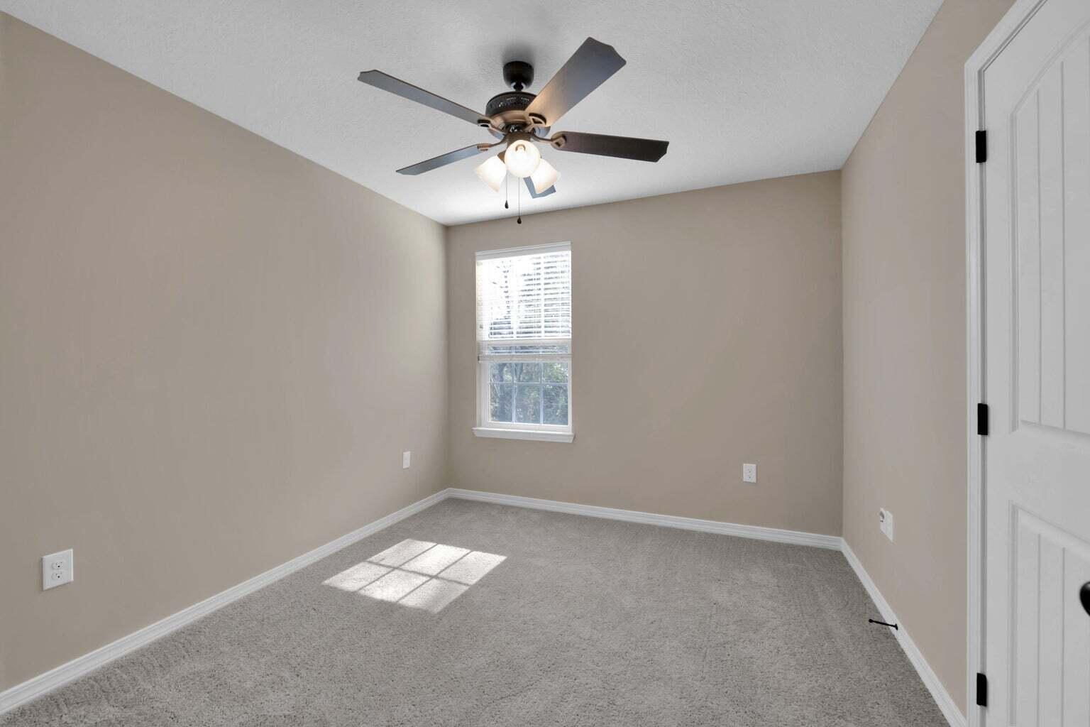 446 Eisenhower Drive Crestview, FL 32539 - Photo 21 of 25 a view of an empty room with a window