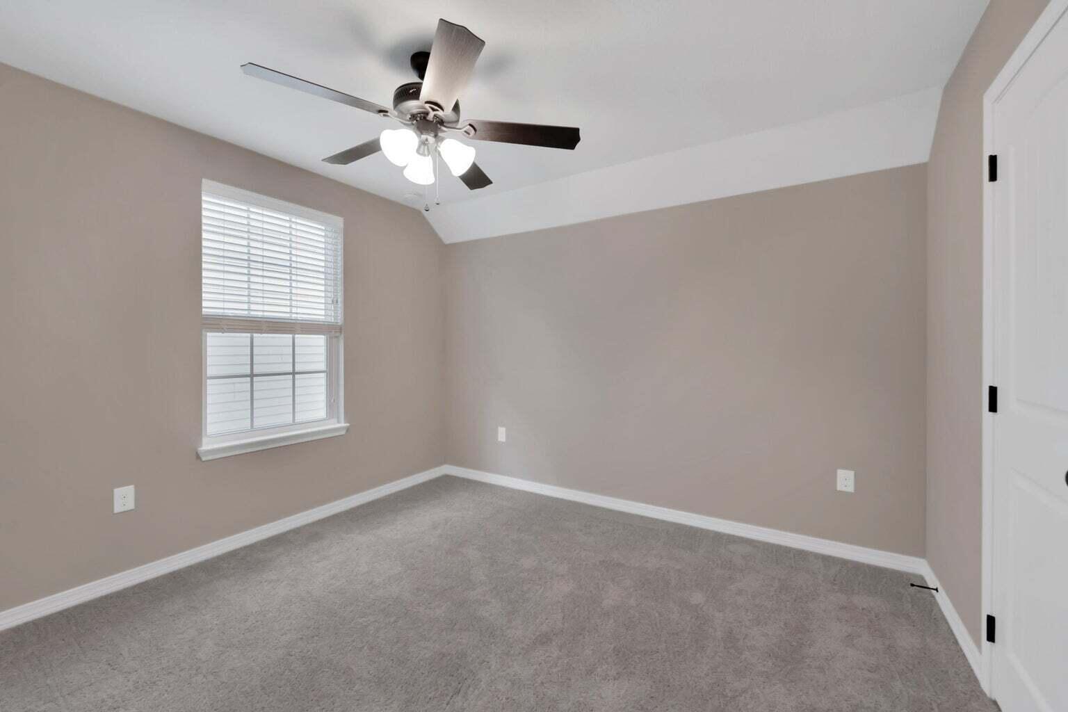 446 Eisenhower Drive Crestview, FL 32539 - Photo 24 of 25 an empty room with windows and fan