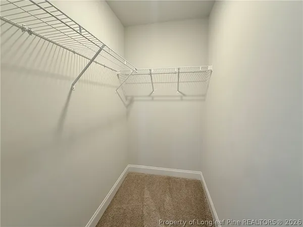 a view of a room with racks on the wall