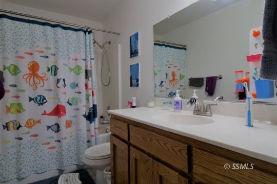 1100 West Iowa Avenue Ridgecrest, CA 93555 - Photo 11 of 19 a bathroom with a sink toilet and shower