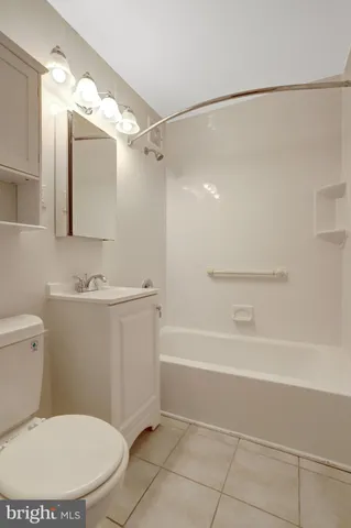 a bathroom with a sink a mirror and a toilet