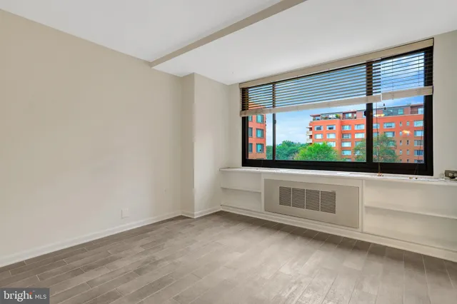 a view of an empty room with a window