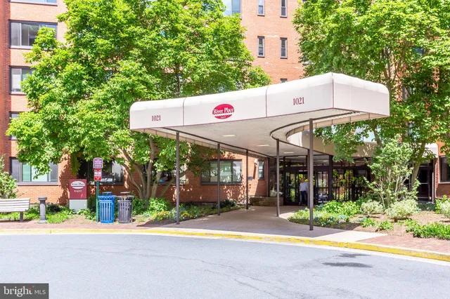 a front view of a building with garden