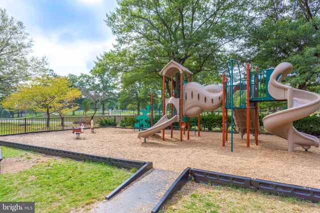 a view of a house with yard and sitting area