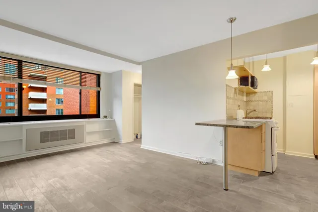 a room with window and pool table