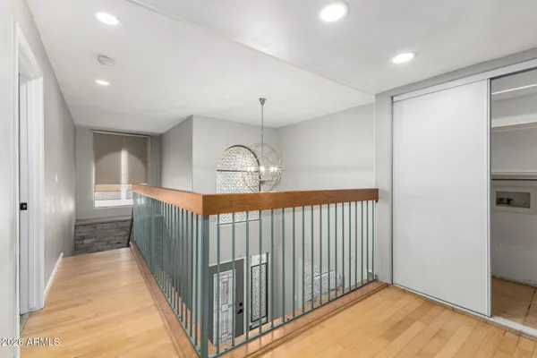a view of a hallway with a chandelier