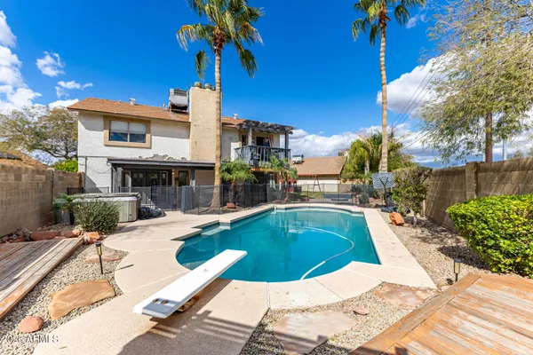 a view of a swimming pool with a patio