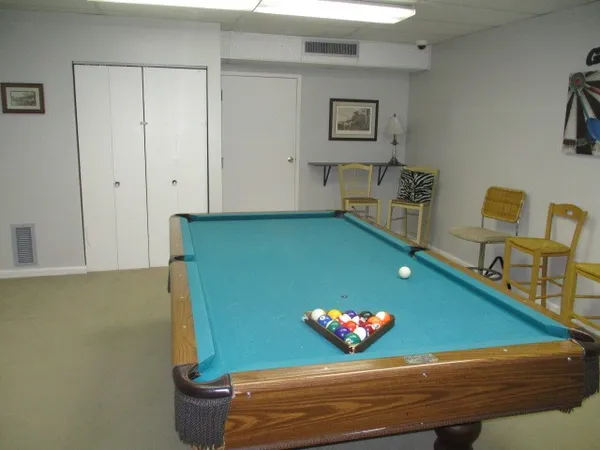 a kitchen with a table and chairs in it