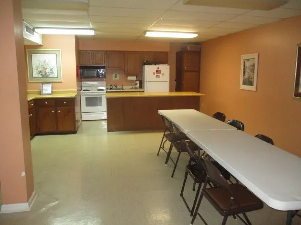 a view of a dining room with furniture and window