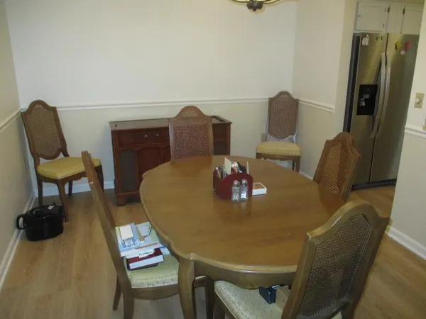 a view of a dining room with furniture and a couch