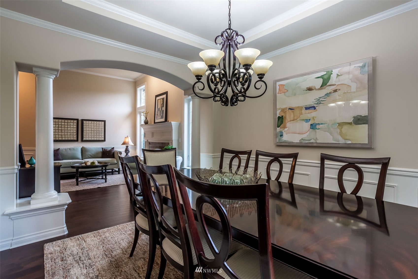 1903 240th Place Southeast Bothell, WA 98021 - Photo 11 of 36 a view of a dining room with furniture a chandelier and wooden floor
