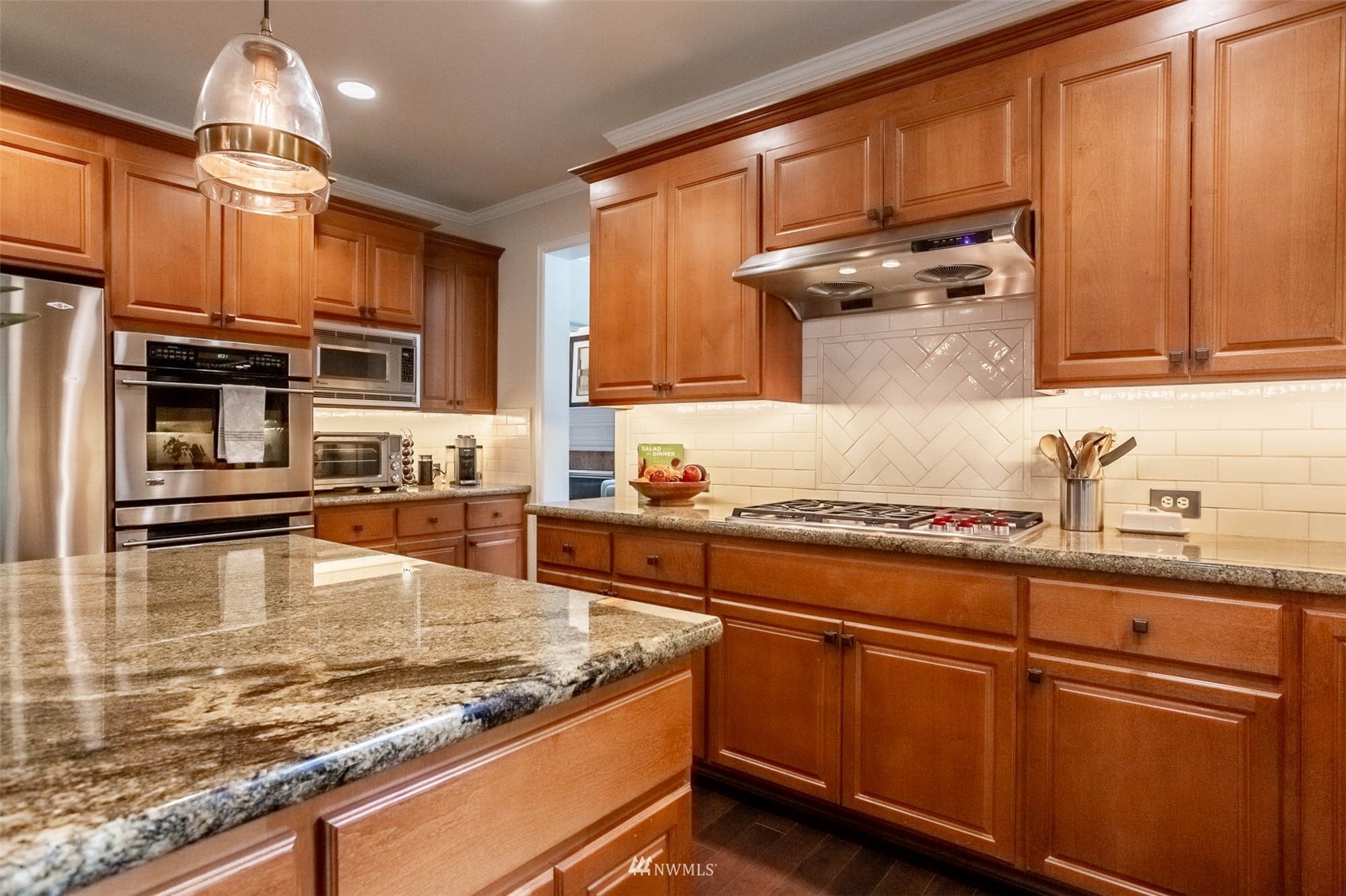 1903 240th Place Southeast Bothell, WA 98021 - Photo 14 of 36 a kitchen with stainless steel appliances granite countertop a sink stove and cabinets