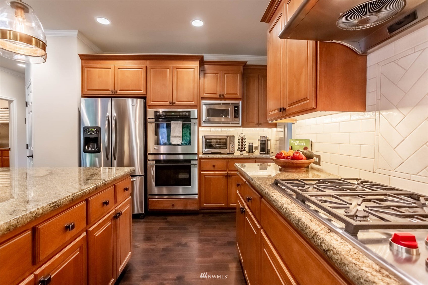 1903 240th Place Southeast Bothell, WA 98021 - Photo 15 of 36 a kitchen with stainless steel appliances granite countertop a stove and a refrigerator