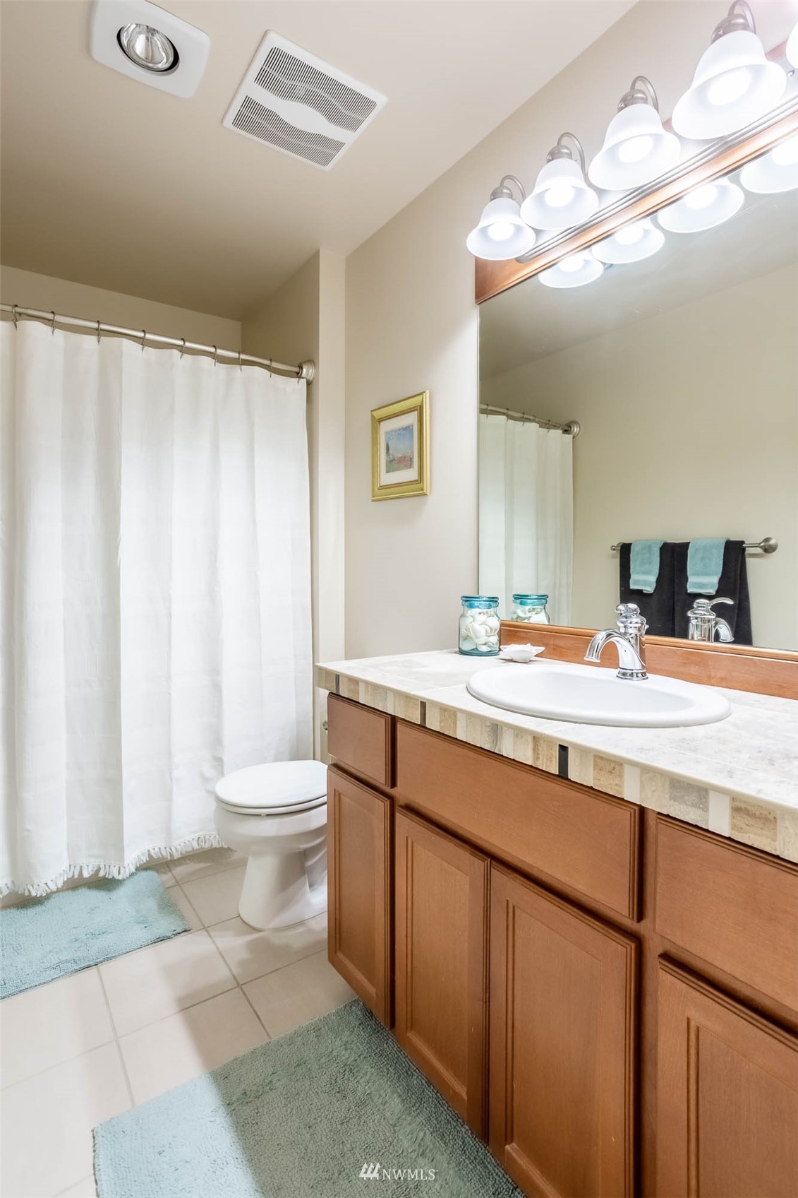 1903 240th Place Southeast Bothell, WA 98021 - Photo 27 of 36 a bathroom with a double vanity sink mirror and toilet