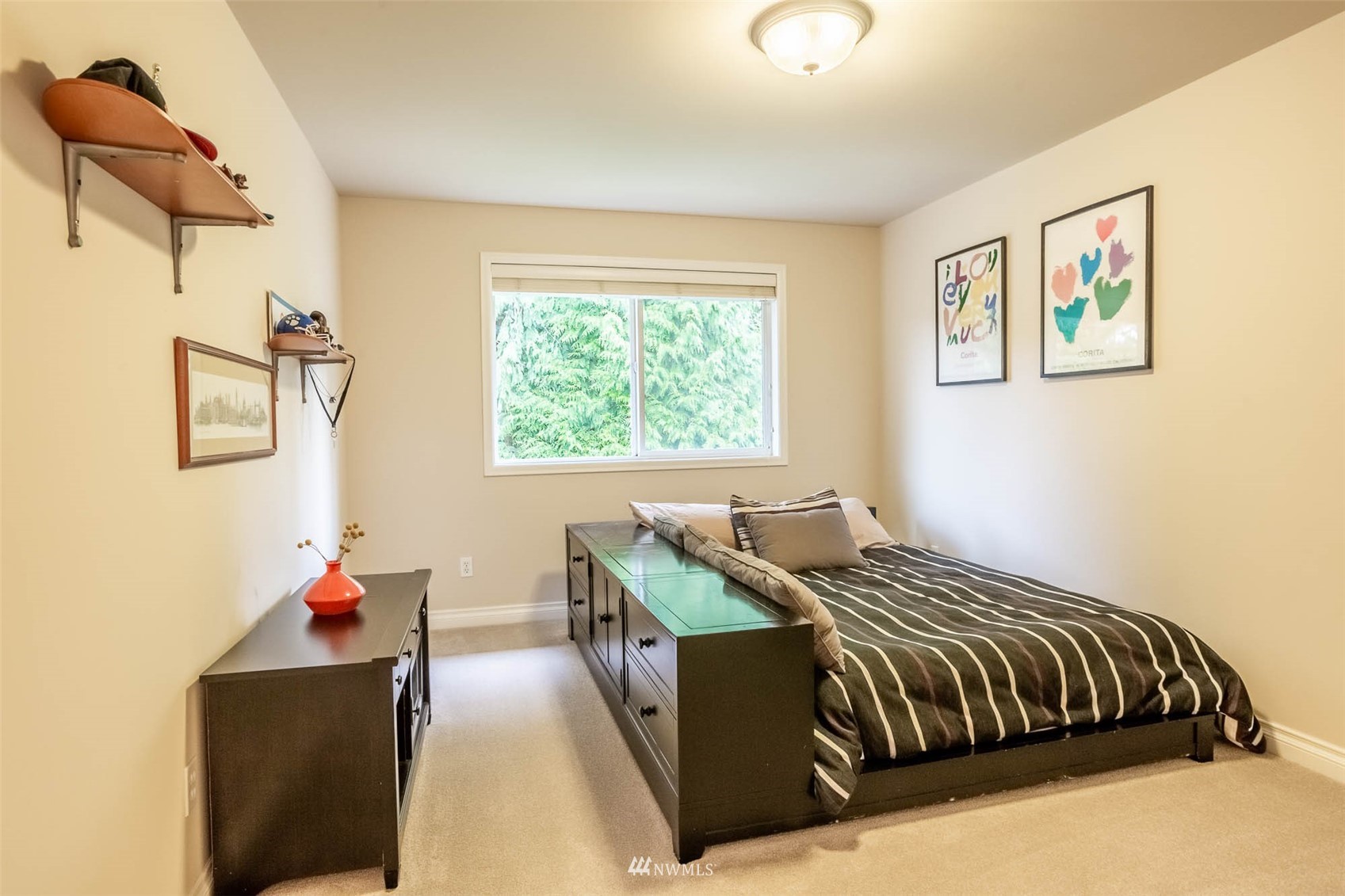 1903 240th Place Southeast Bothell, WA 98021 - Photo 28 of 36 a bed sitting in a bedroom next to a window