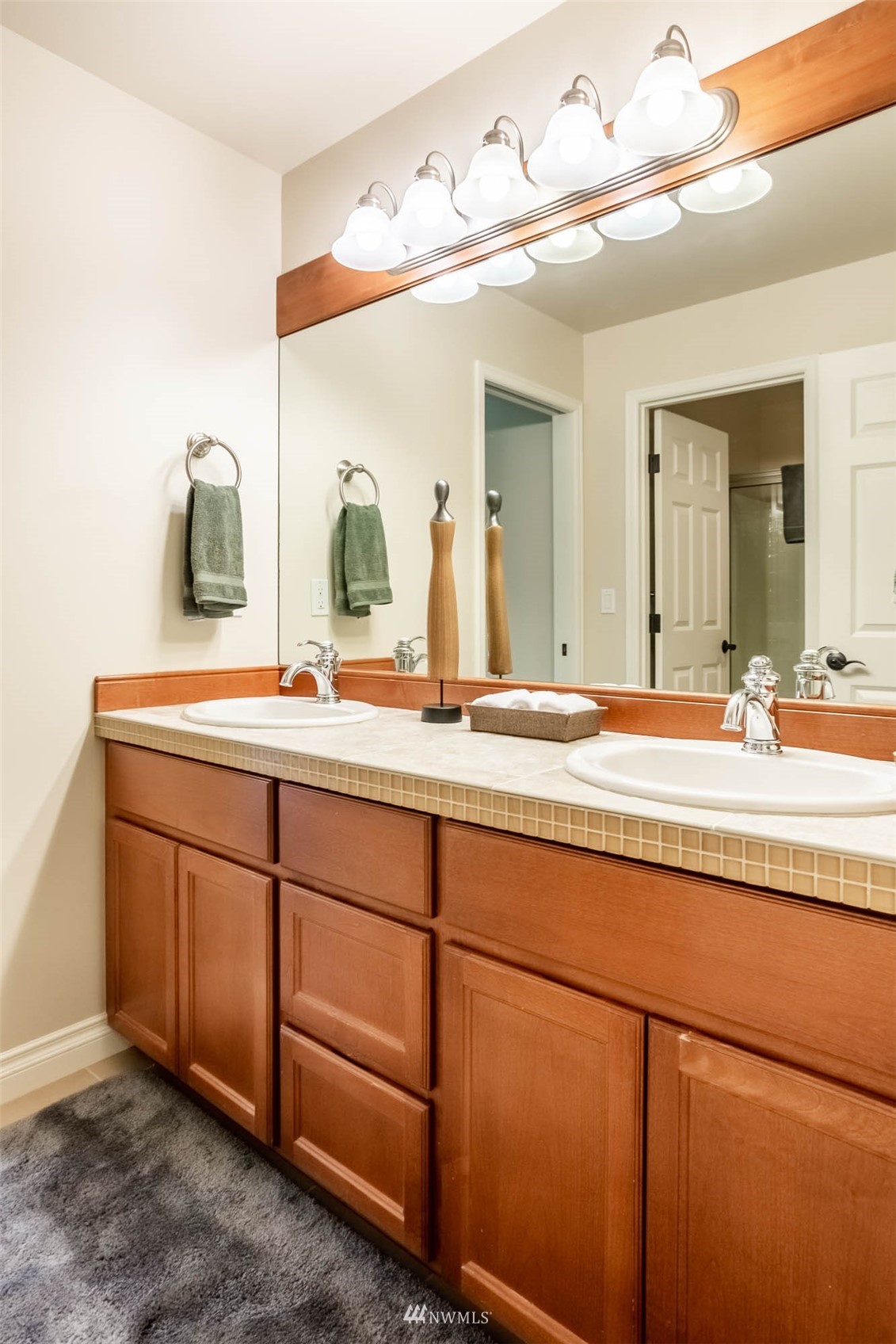 1903 240th Place Southeast Bothell, WA 98021 - Photo 29 of 36 a bathroom with a sink and a mirror