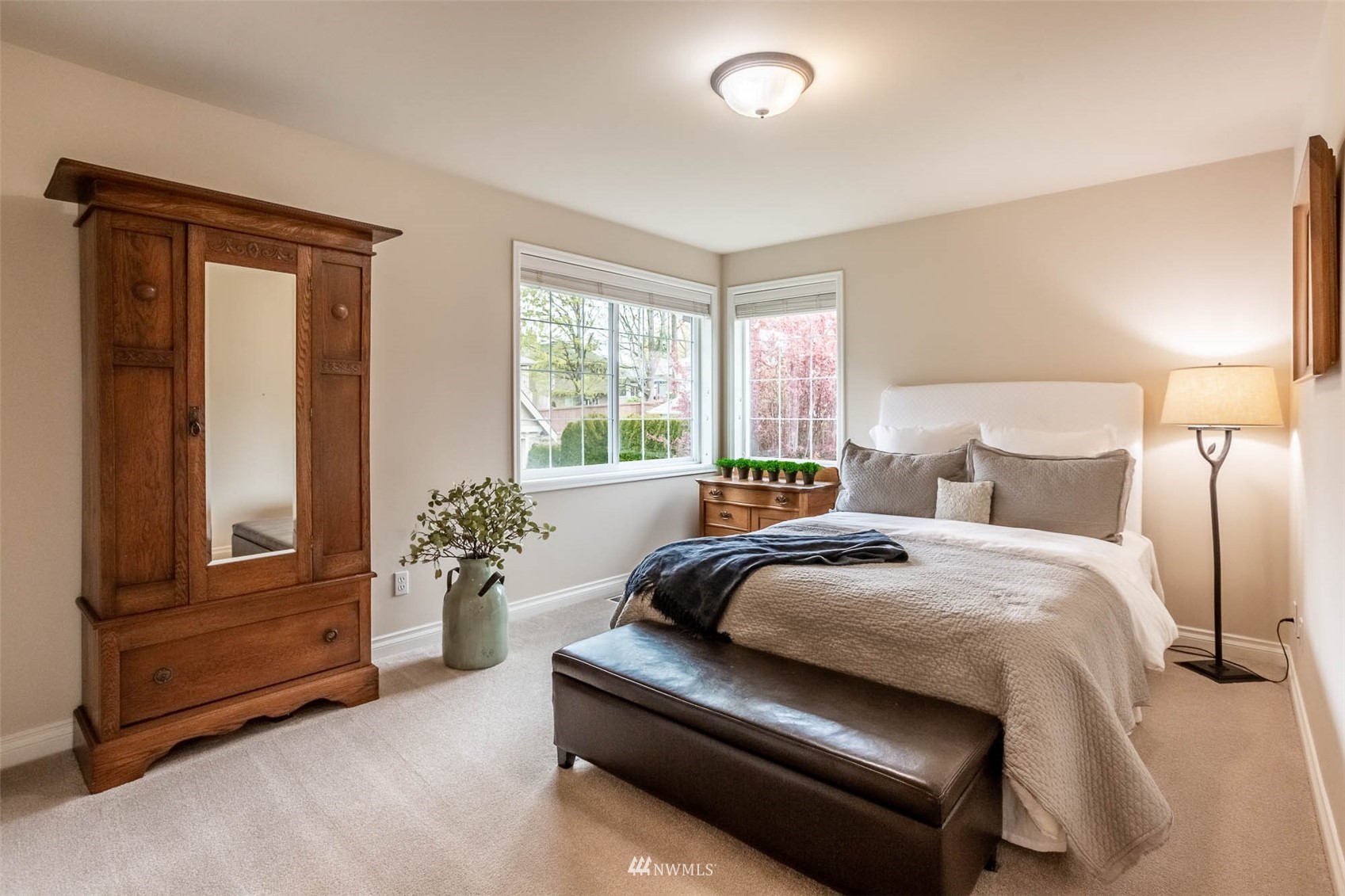1903 240th Place Southeast Bothell, WA 98021 - Photo 30 of 36 a bedroom with a balcony a bed and a couch