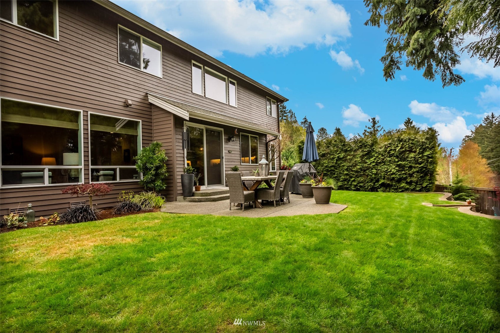 1903 240th Place Southeast Bothell, WA 98021 - Photo 33 of 36 a view of a house with a yard porch and sitting area