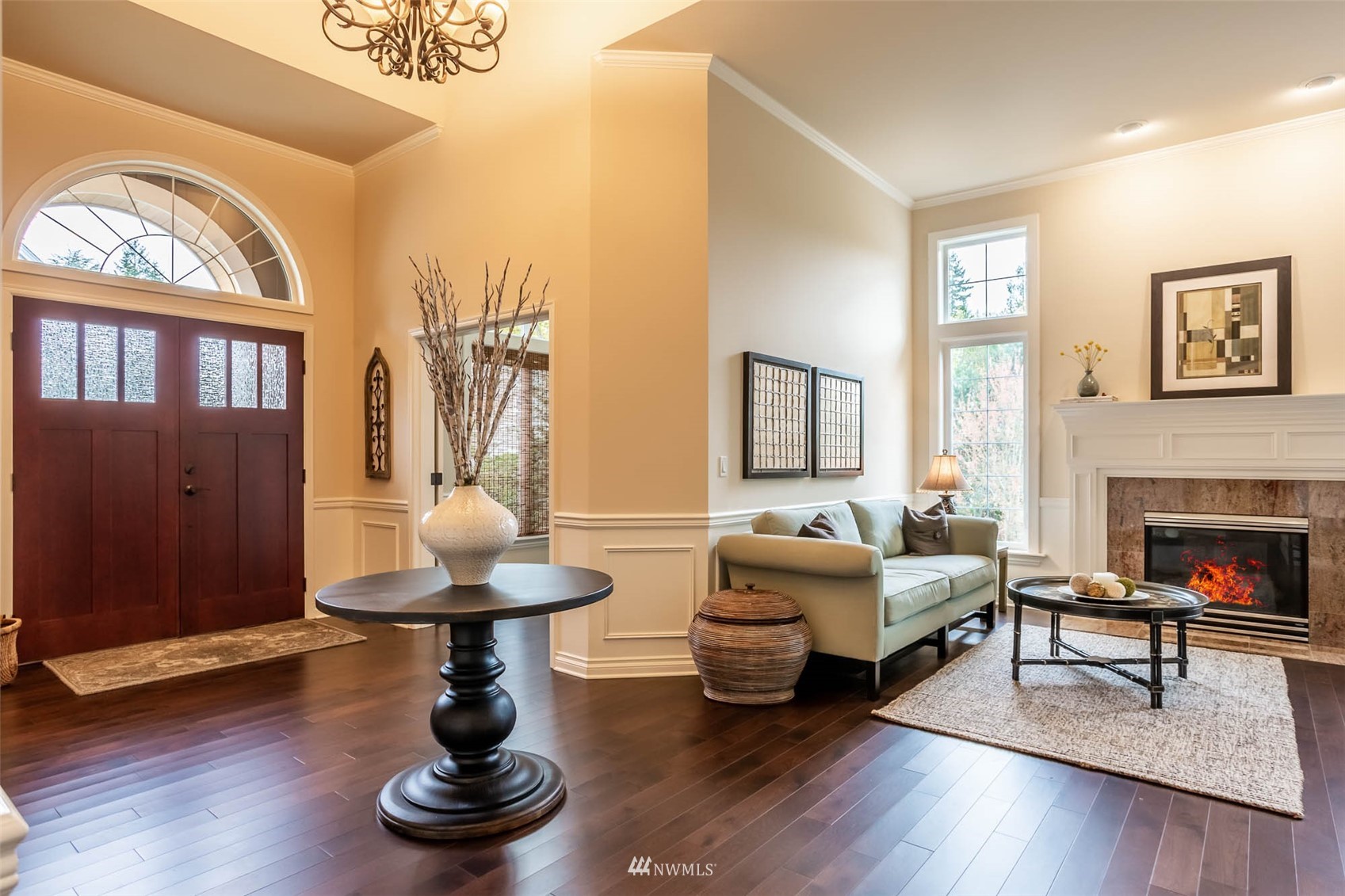 1903 240th Place Southeast Bothell, WA 98021 - Photo 6 of 36 a living room with furniture a fireplace and a large window