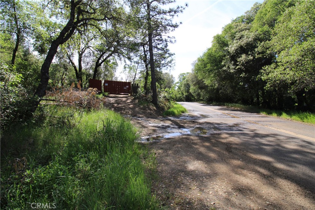 0 Black Bart Road Oroville, CA 95966 - Photo 32 of 38 a backyard of a house with yard and trampoline