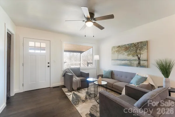 a living room with furniture and a window