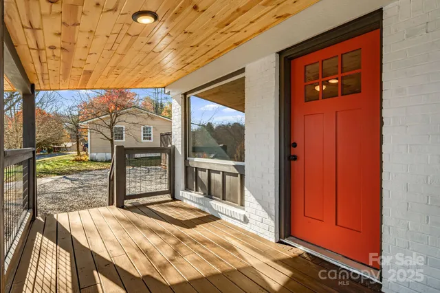 a kitchen with stainless steel appliances granite countertop a sink and a wooden floors