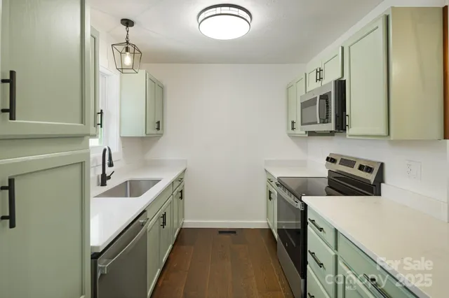 a bathroom with a sink and mirror
