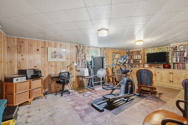 7576 South Jefferson Street Midvale, UT 84047 - Photo 32 of 53 Finished space featuring wood-paneled walls and a drop ceiling with integrated lighting