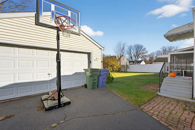 a view of a backyard with sitting area
