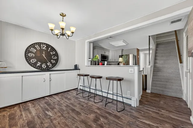 a view of a livingroom with furniture and chandelier