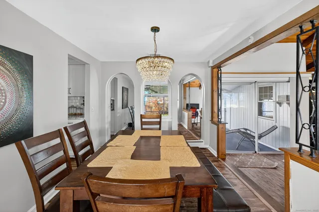 a view of a dining room with furniture window and wooden floor
