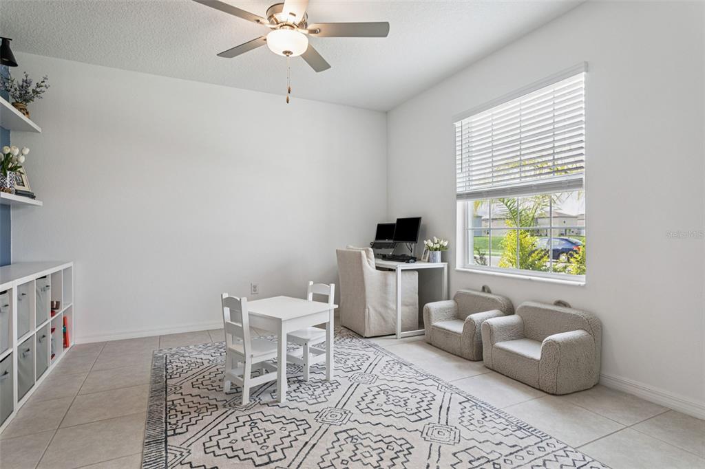 11693 Lavender Loop Spring Hill Spring Hill, FL 34609 - Photo 12 of 34 a living room with furniture and a window