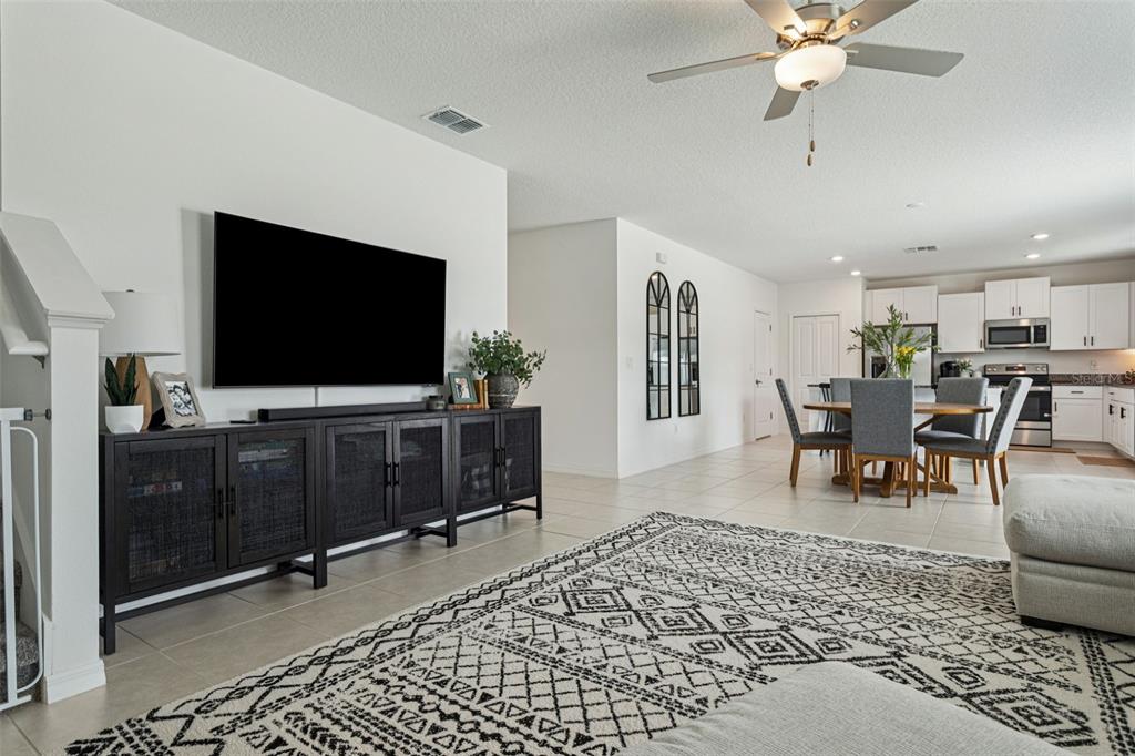 11693 Lavender Loop Spring Hill Spring Hill, FL 34609 - Photo 13 of 34 a living room with furniture and a flat screen tv