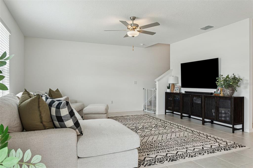 11693 Lavender Loop Spring Hill Spring Hill, FL 34609 - Photo 15 of 34 a living room with furniture and a flat screen tv