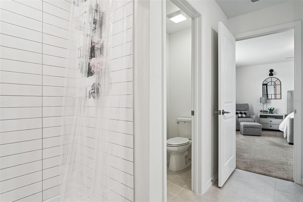 11693 Lavender Loop Spring Hill Spring Hill, FL 34609 - Photo 21 of 34 a bathroom with a toilet and a shower