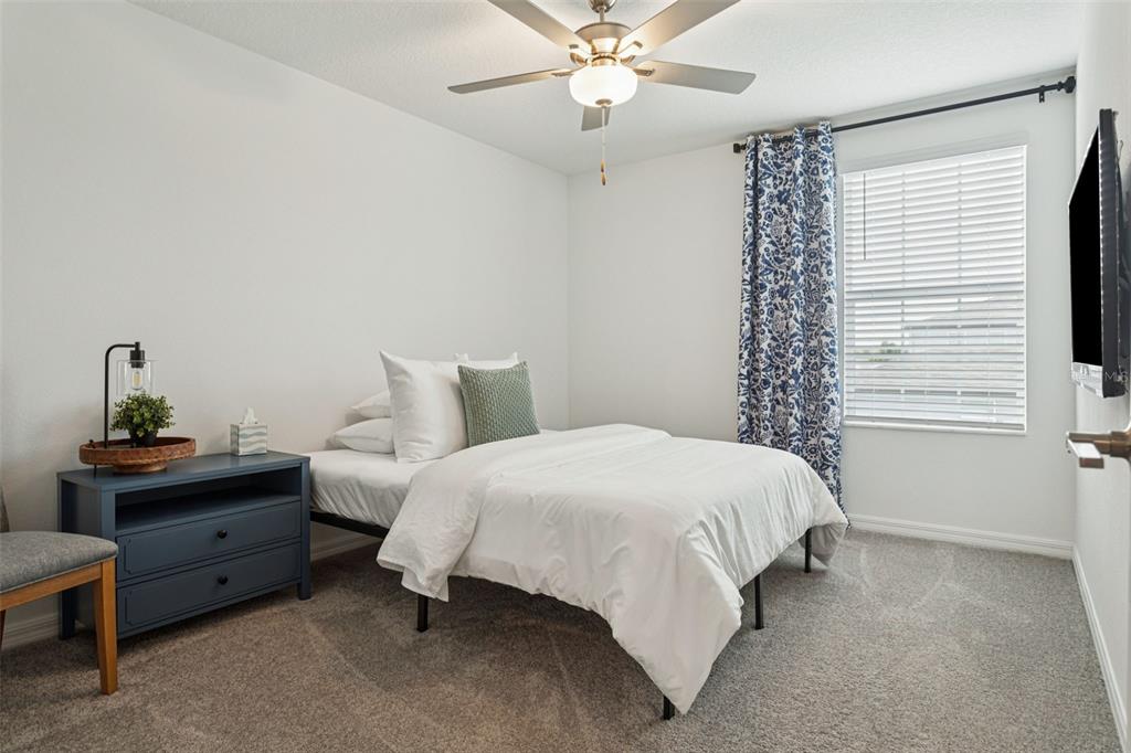 11693 Lavender Loop Spring Hill Spring Hill, FL 34609 - Photo 23 of 34 a bedroom with a bed and a window