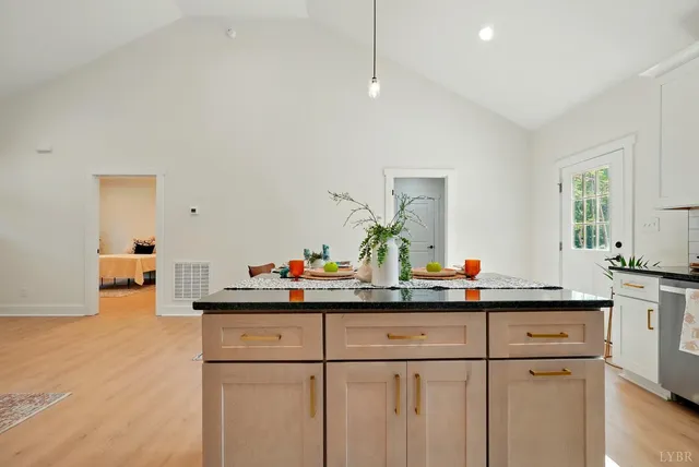 a view of a dining room with furniture and window