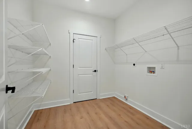 a bathroom with a shower and a glass door