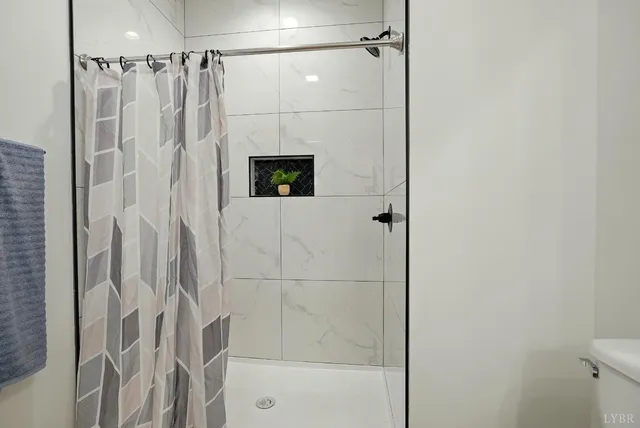 a bathroom with double sink and a mirror