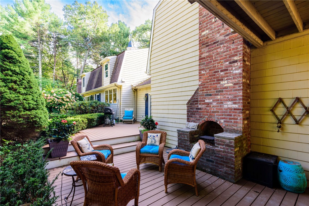 31 Raccoon Hill Road West Greenwich, RI 02817 - Photo 42 of 48 Deck area with outdoor fireplace and there currently is hot tub in this area (hot tub needs a motor)