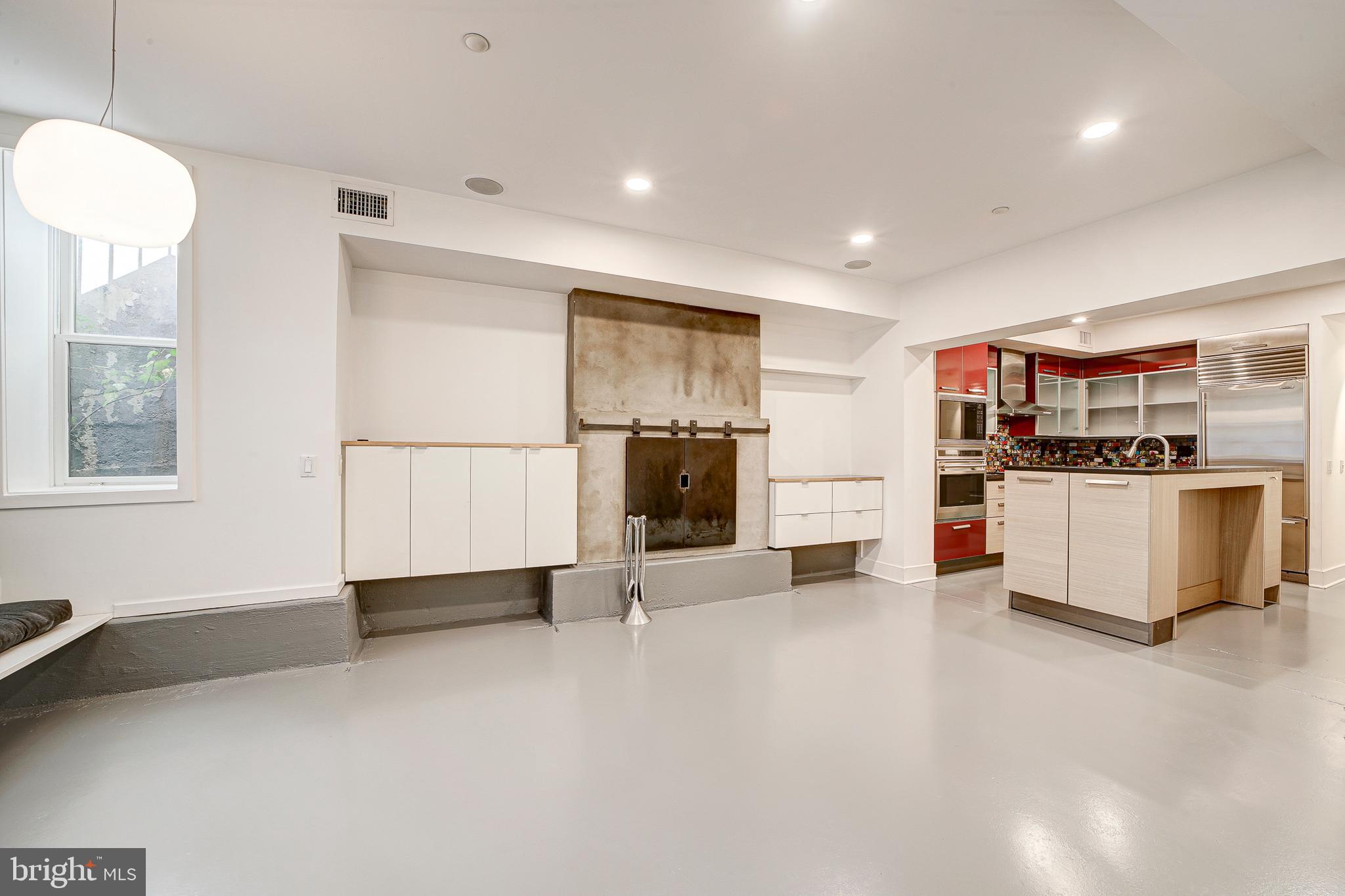 1517 Church Street Northwest, Unit A Washington, DC 20005 - Photo 1 of 23 a view of kitchen with stainless steel appliances kitchen island a large counter top and a stove top oven