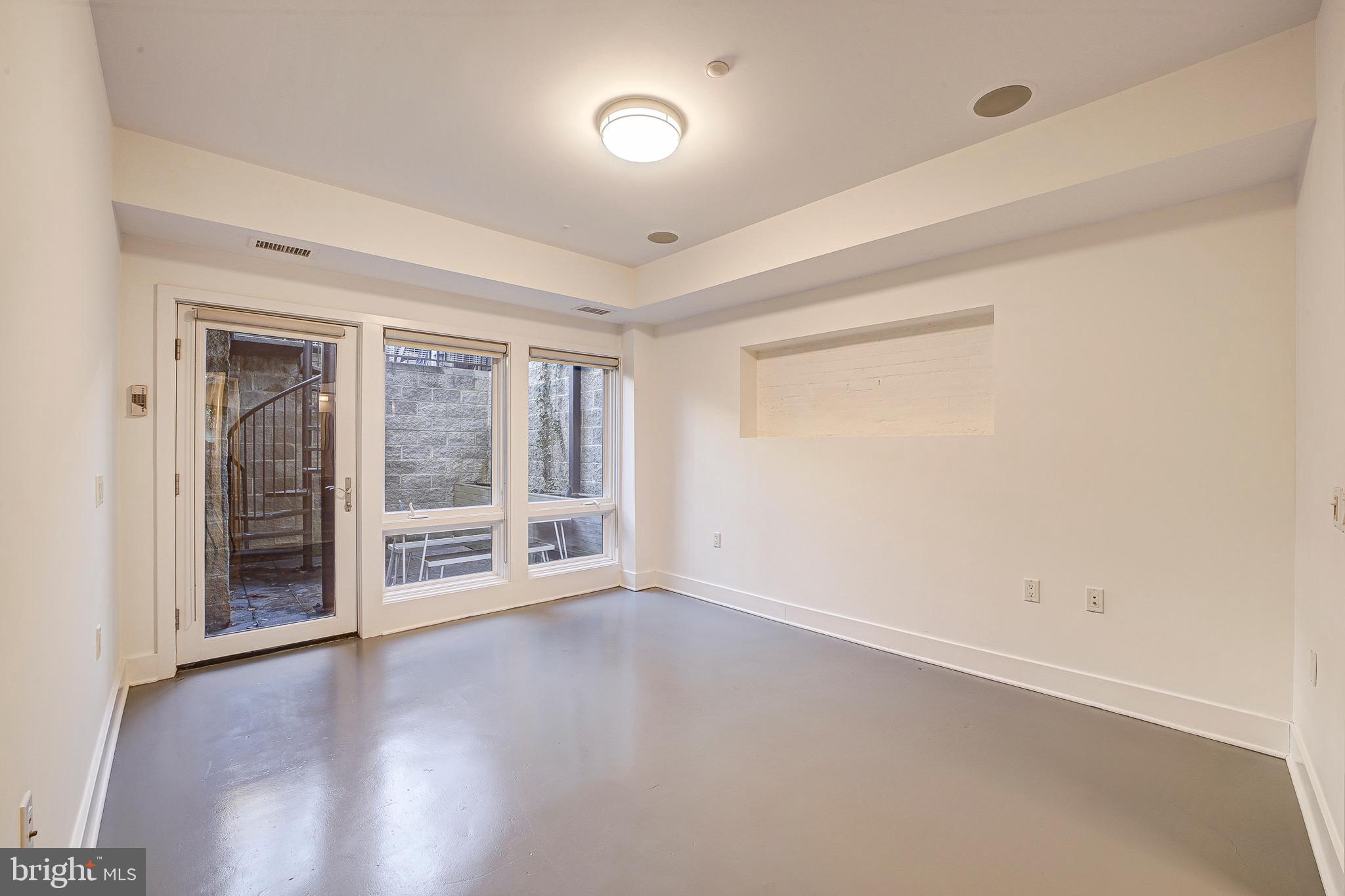 1517 Church Street Northwest, Unit A Washington, DC 20005 - Photo 13 of 23 wooden floor in an empty room with a window