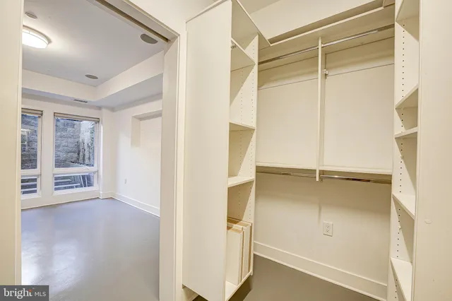 a view of an empty room with a window