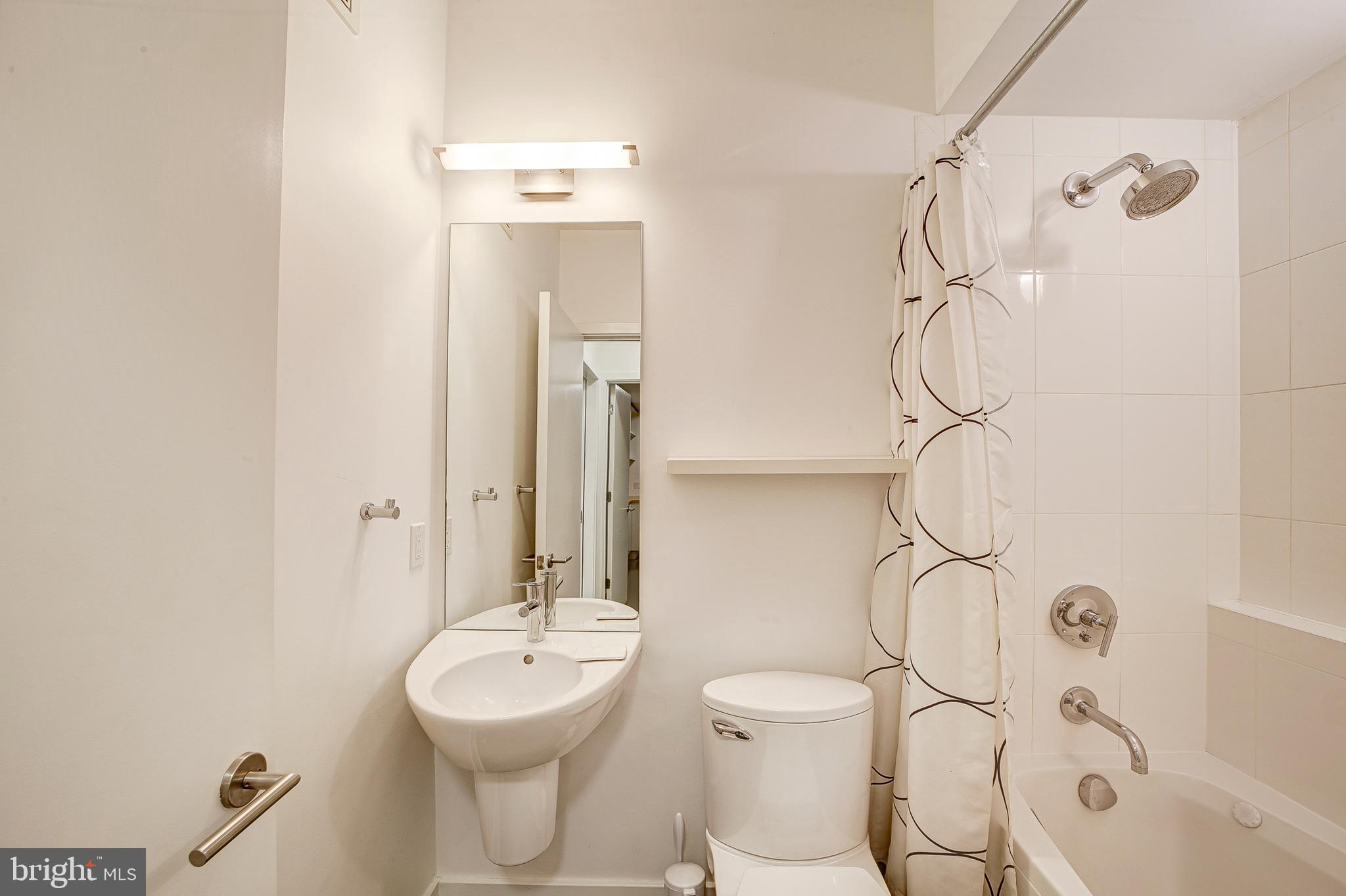 1517 Church Street Northwest, Unit A Washington, DC 20005 - Photo 19 of 23 a bathroom with a sink toilet and shower
