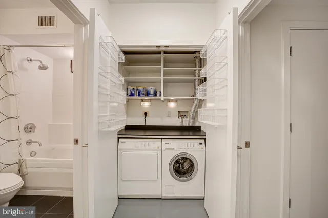 a utility room with dryer and washer